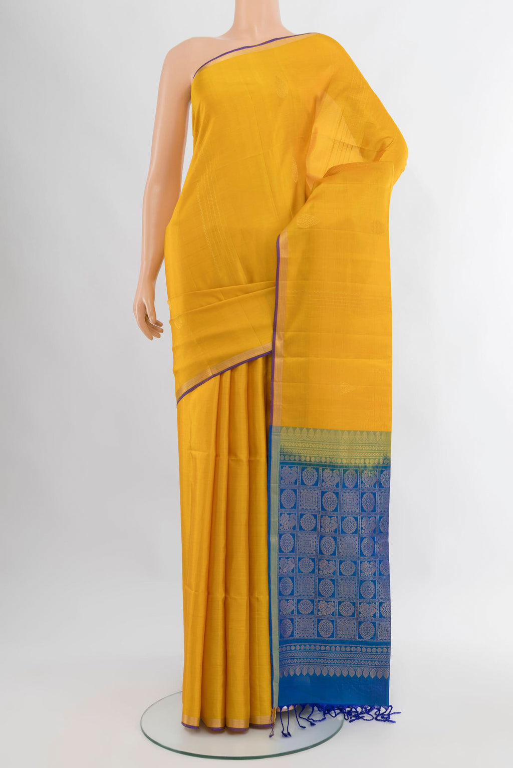 Yellow Soft Silk Saree with Stripes on the body and Zari Border.  displayed on a mannequin