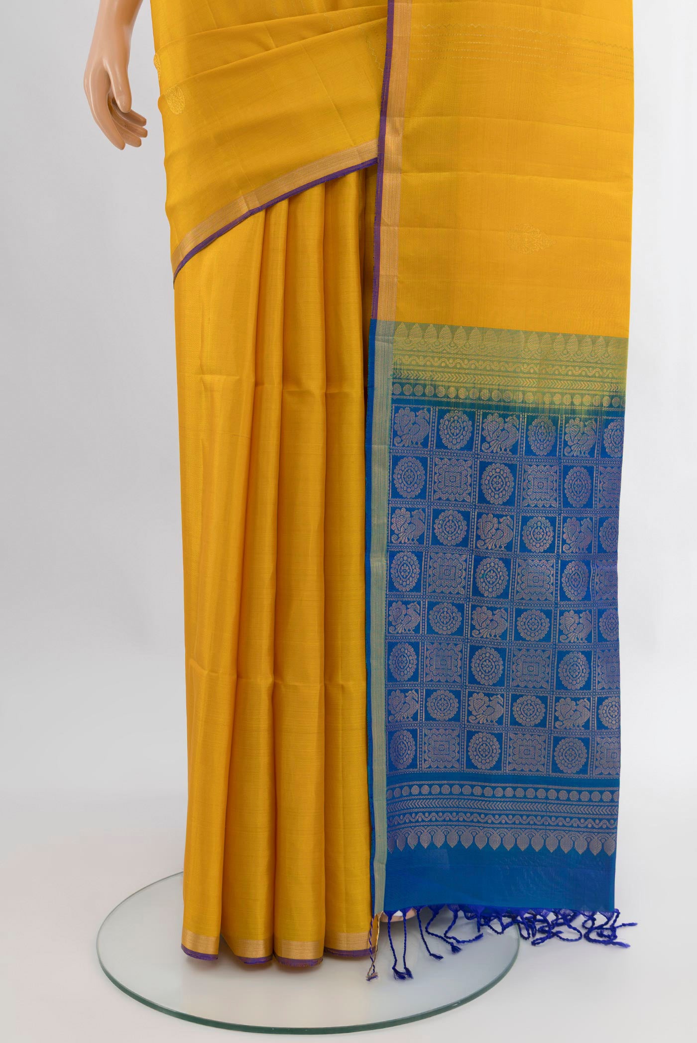 Pleats and pallu of Yellow Soft Silk Saree with Stripes on the body and Zari Border. 
