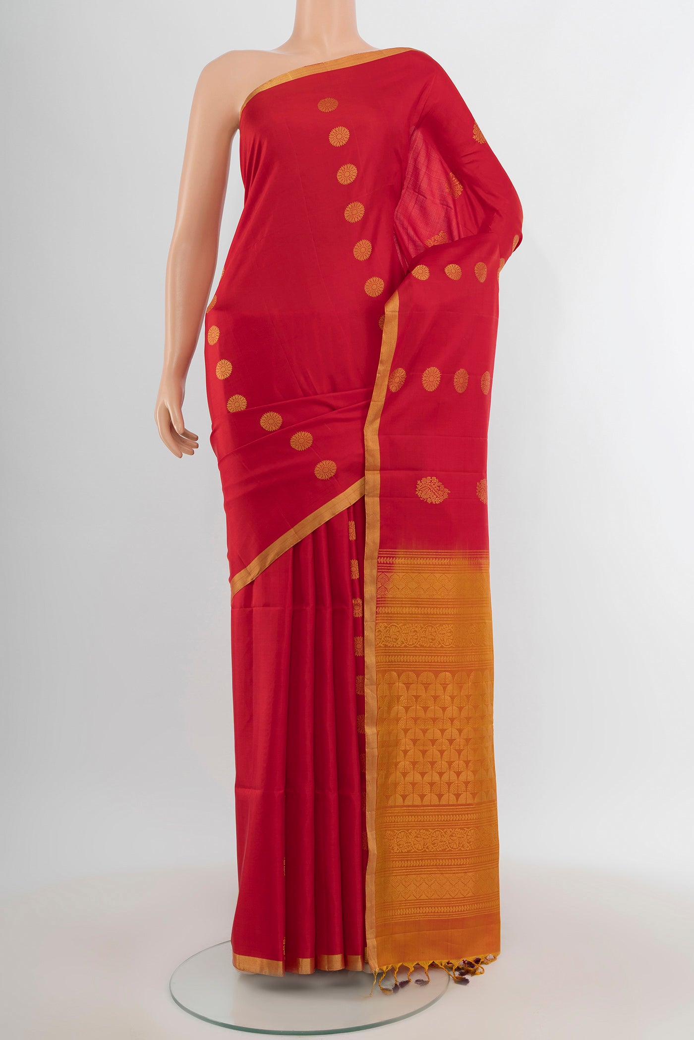 Red Soft Silk Saree with Zari Butta on the body and Zari Border.  displayed on a mannequin