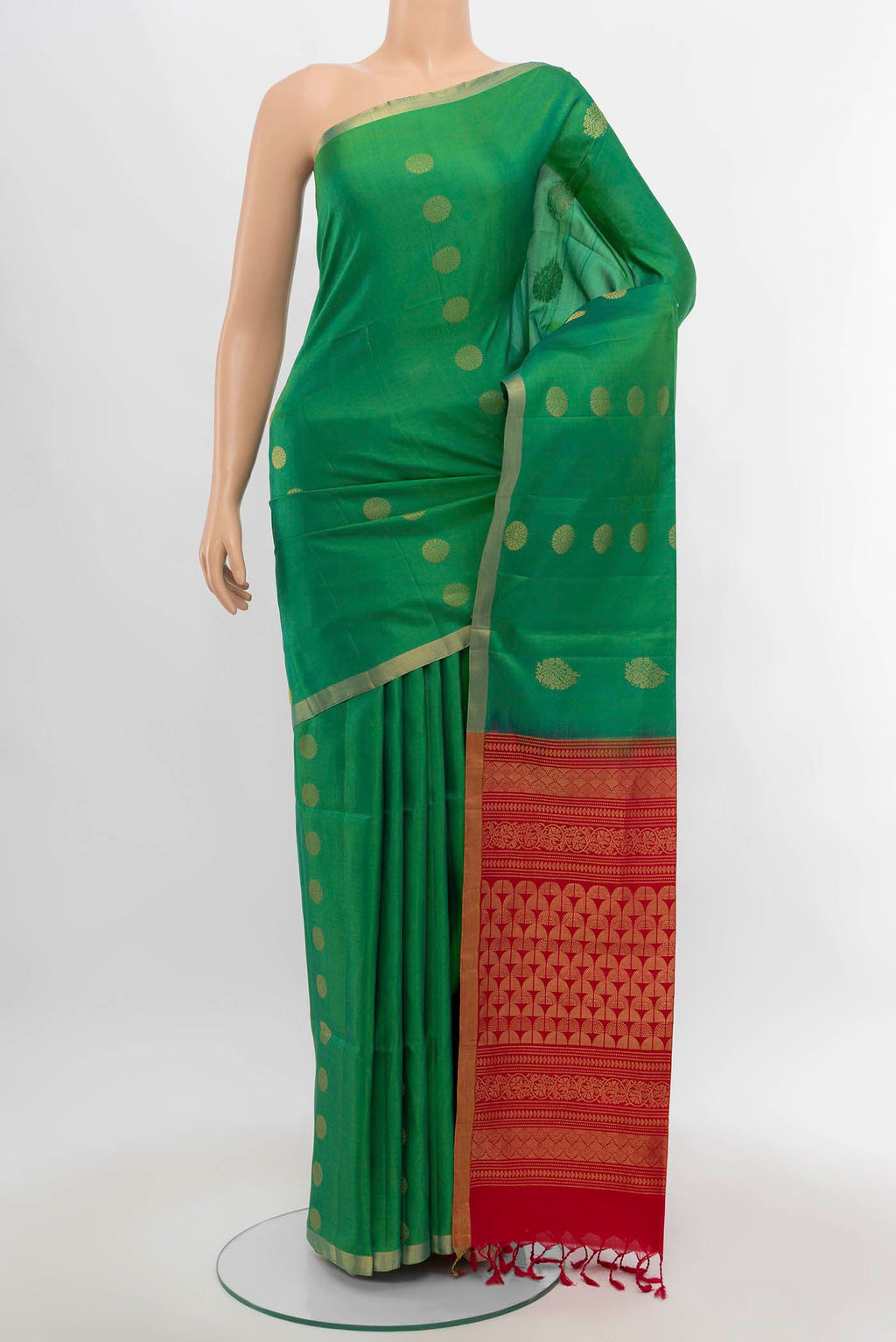 Parrot Green Soft Silk Saree with Zari Butta on the body and Silk Border.  displayed on a mannequin