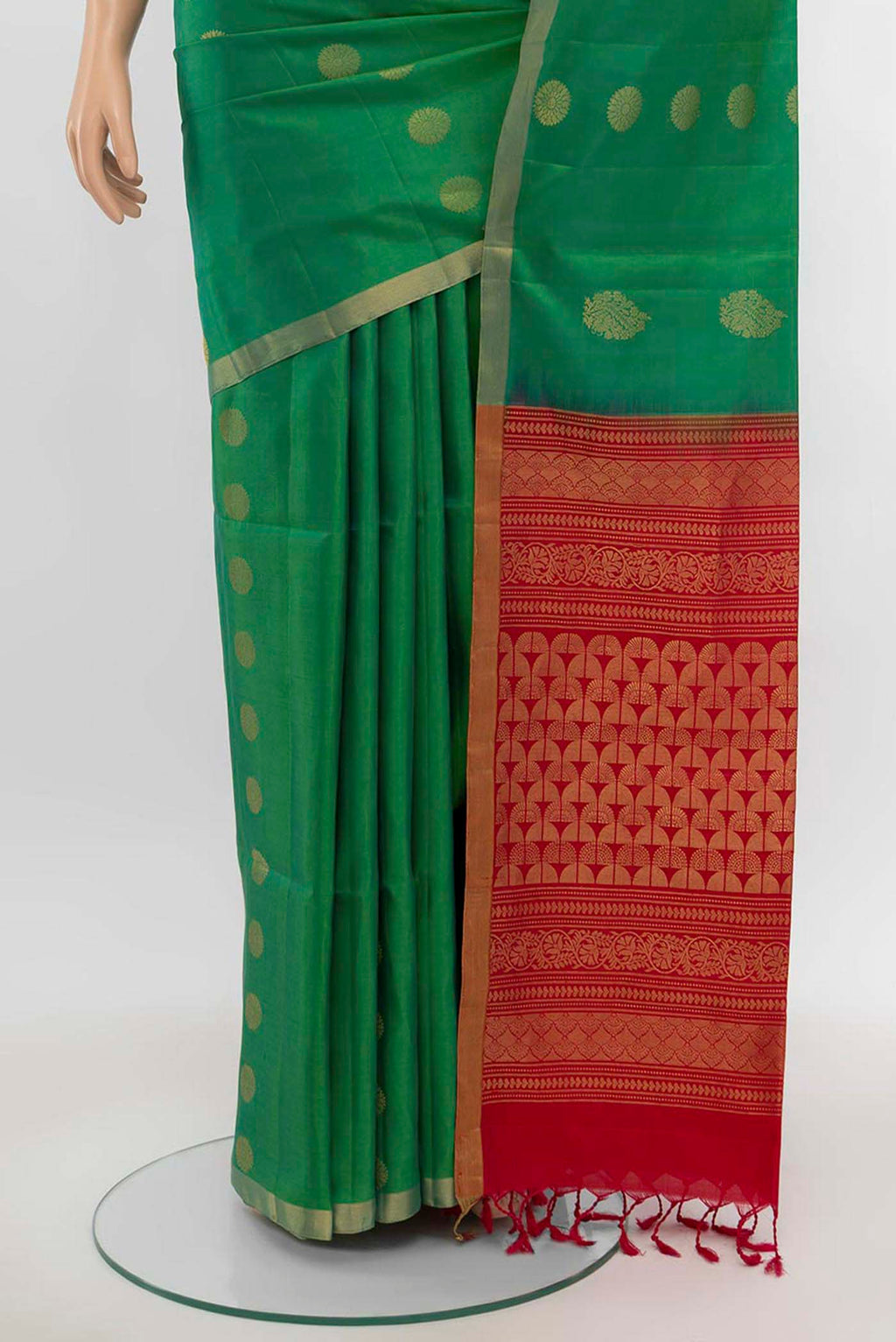 Pleats and pallu of Parrot Green Soft Silk Saree with Zari Butta on the body and Silk Border. 