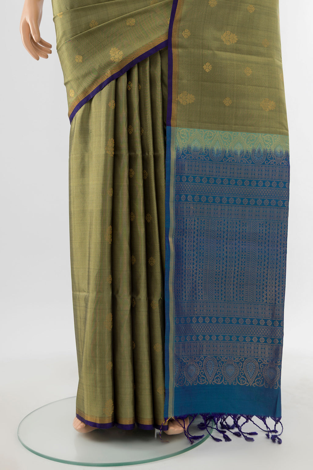 Pleats and pallu of Light Green Soft Silk Saree with Zari Butta on the body and Silk Border. 