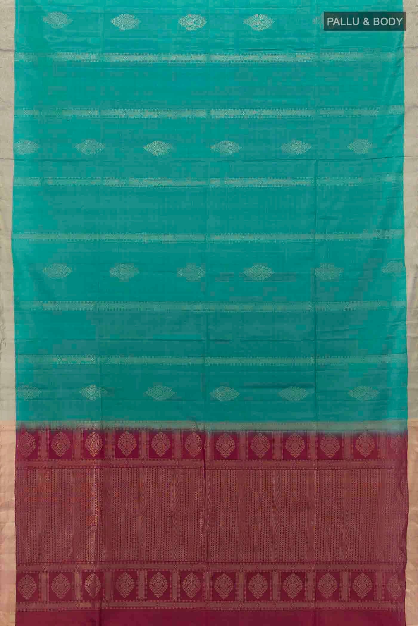 Flat view of Peacock Blue Soft Silk Saree with Zari Butta on the body and Zari Border