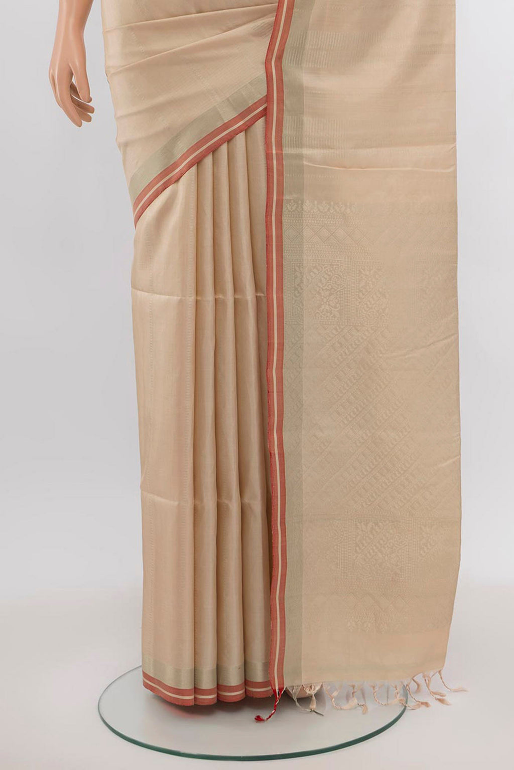 Pleats and pallu of Beige Soft Silk Saree with Zari Butta on the body and Silk Border. 