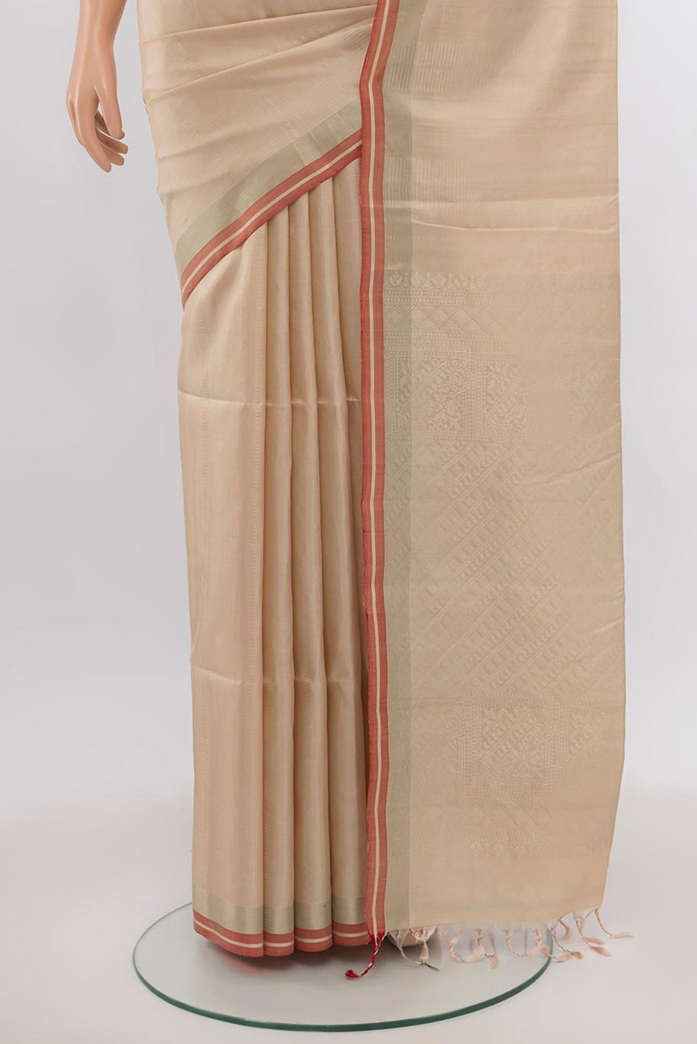 Pleats and pallu of Beige Soft Silk Saree with Zari Butta on the body and Silk Border. 