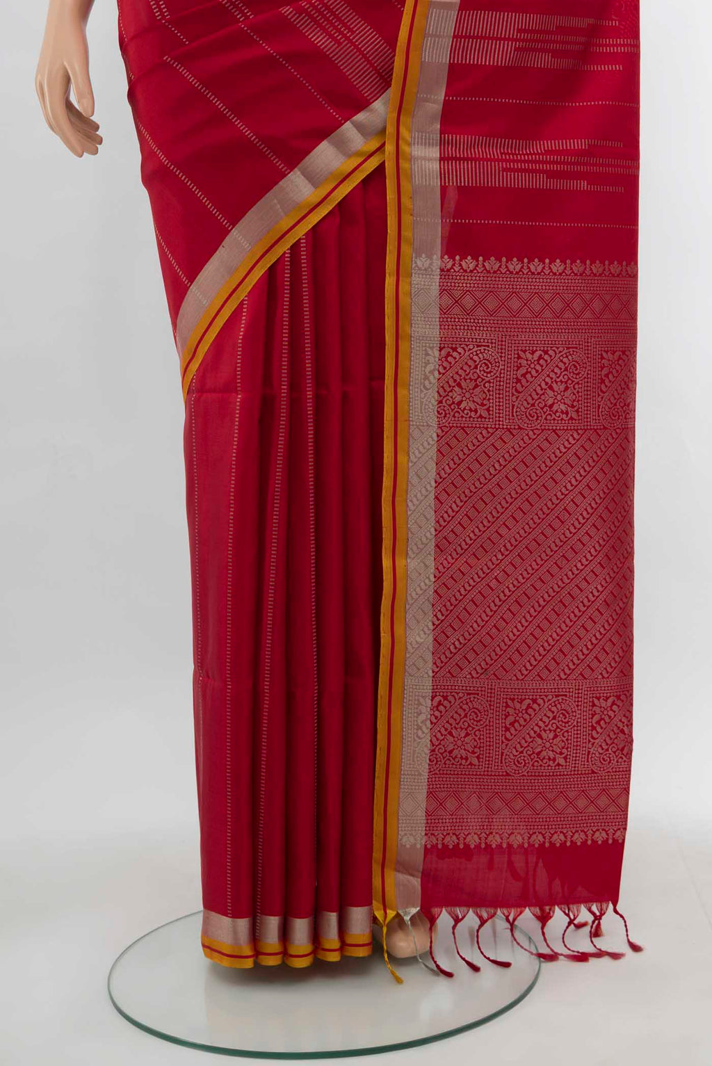 Pleats and pallu of Maroon Soft Silk Saree with Zari Butta on the body and Silk Border. 