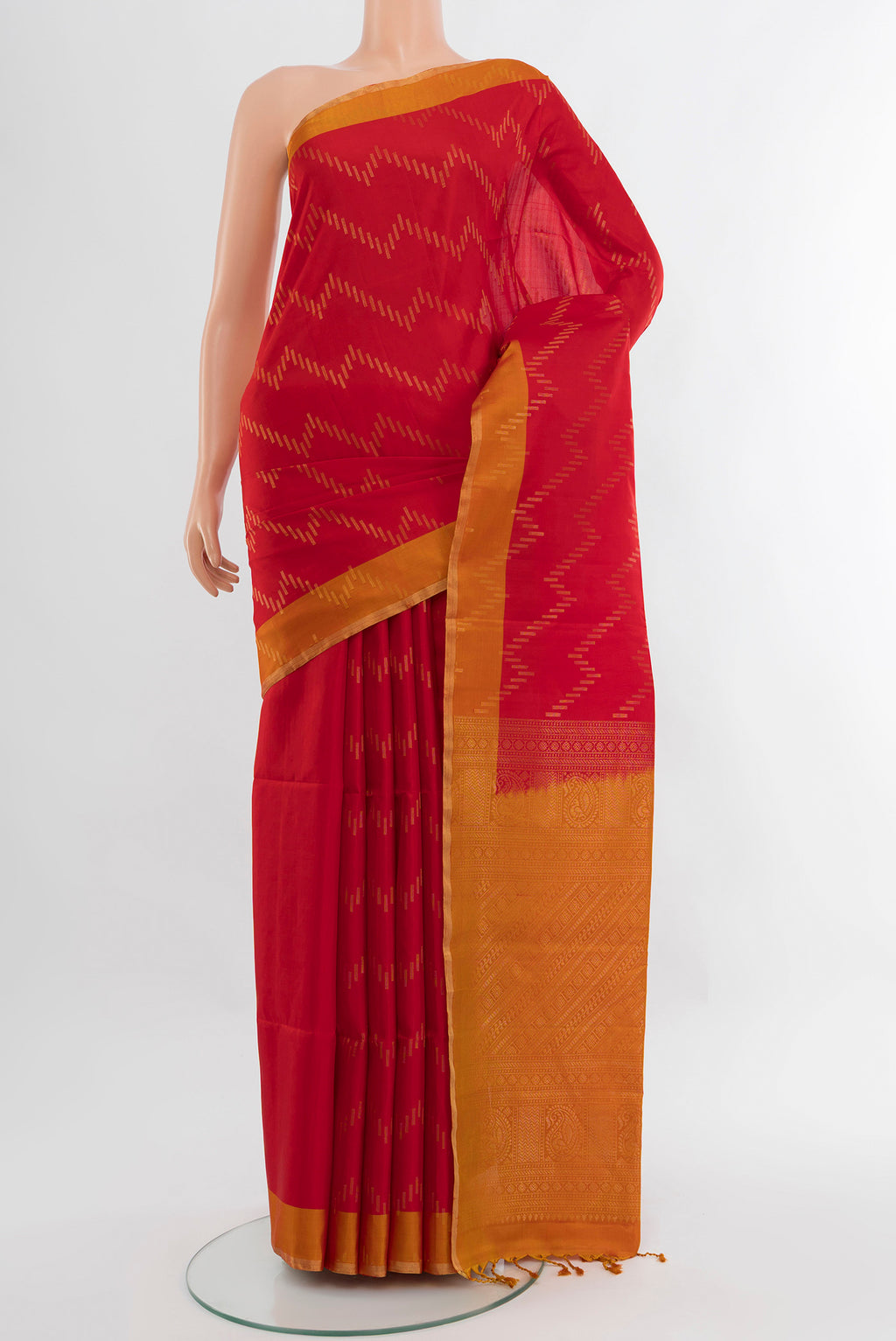 Red Soft Silk Saree with Zari Butta on the body and Zari Border.  displayed on a mannequin