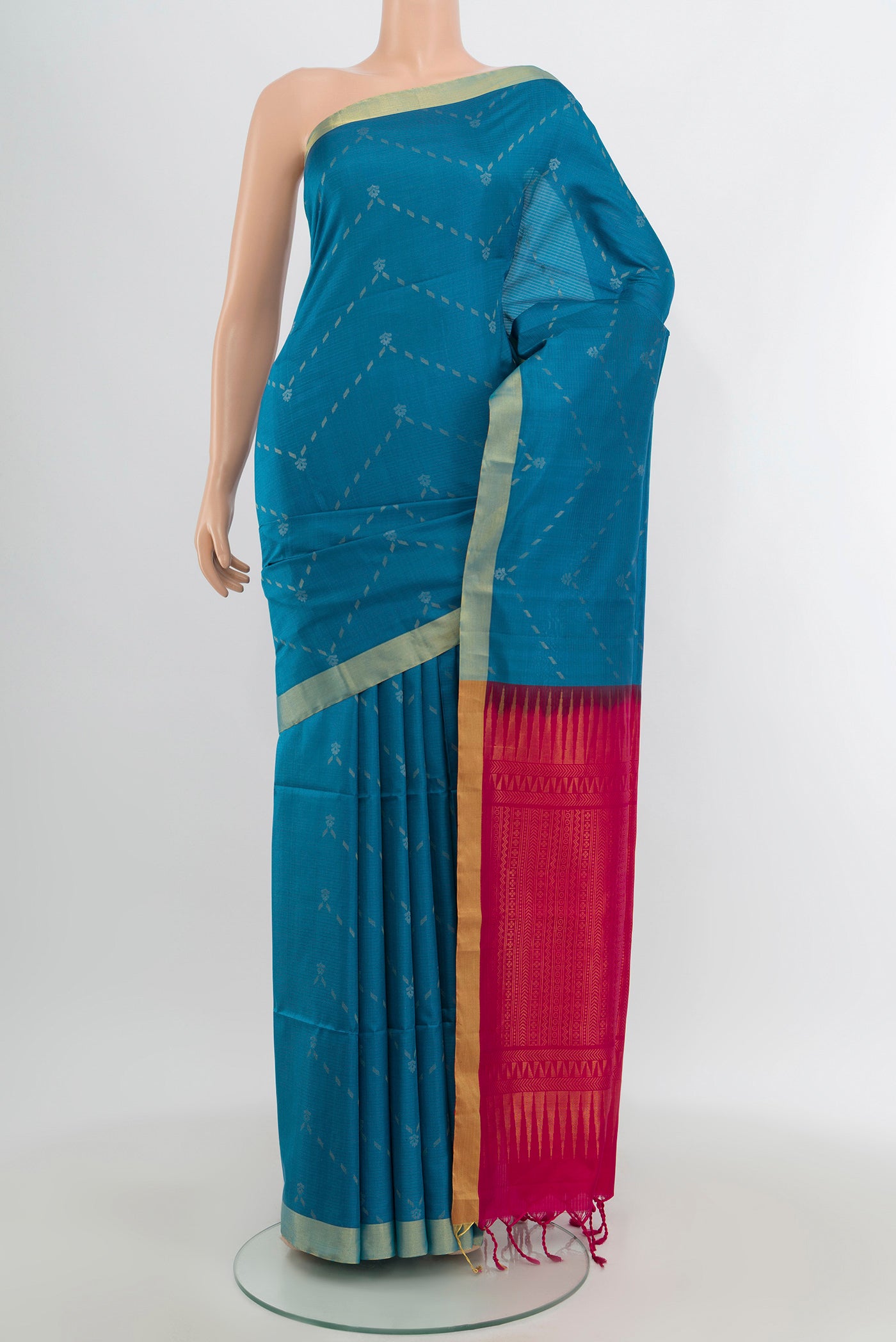Blue Soft Silk Saree with Zari Butta on the body and Zari Border.  displayed on a mannequin