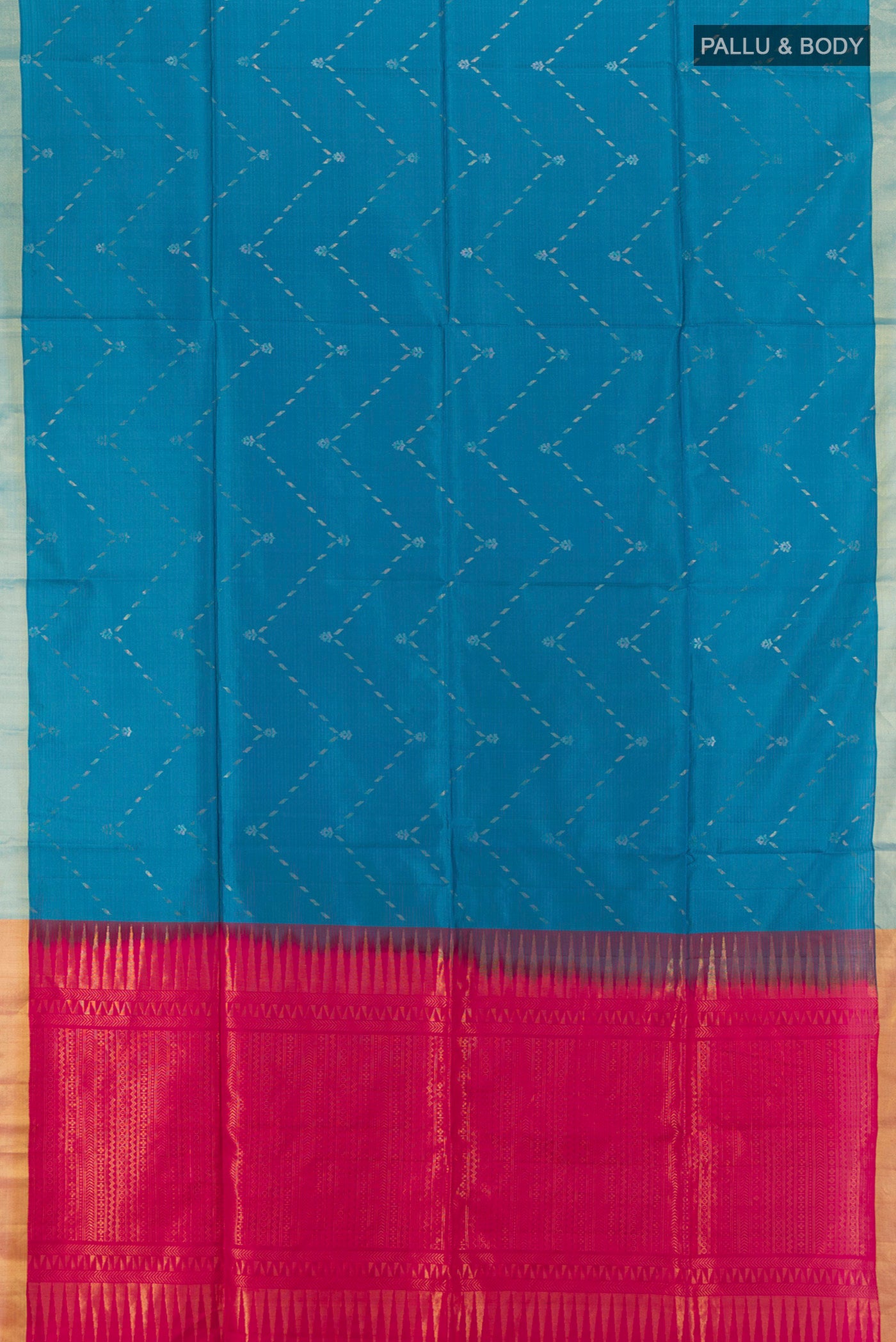 Flat view of Blue Soft Silk Saree with Zari Butta on the body and Zari Border. 
