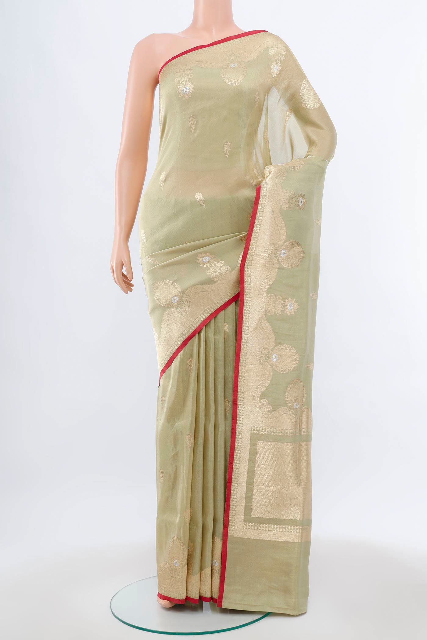 Pista Green Banarasi Silk Saree with Zari Brocade on the body and Silk Border.  displayed on a mannequin
