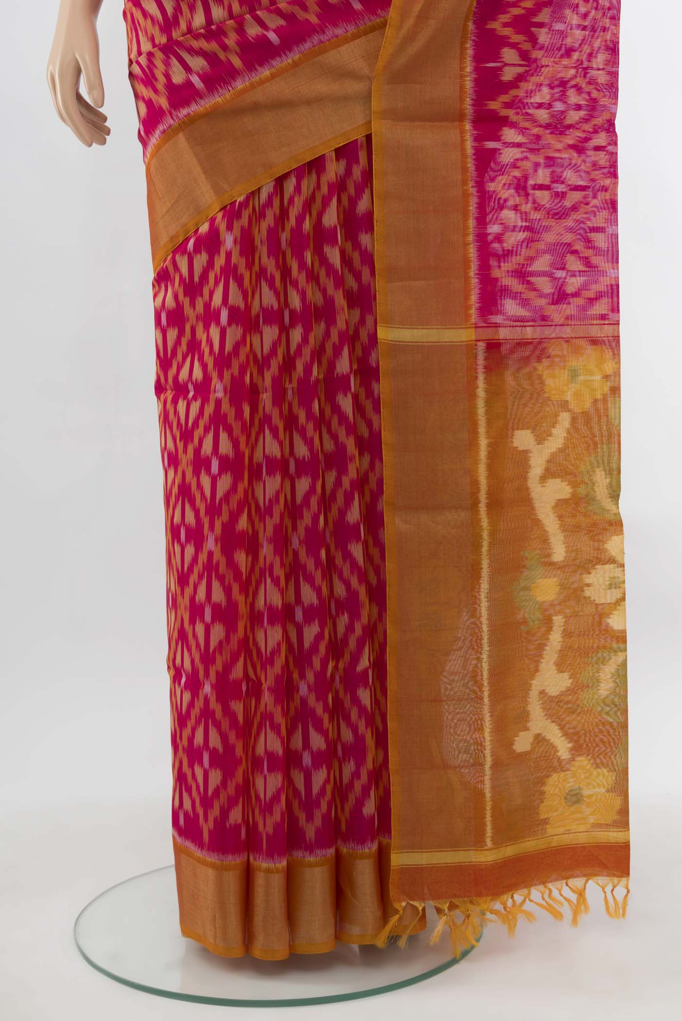 Pleats and pallu of Magenta Maheshwari Silk Cotton Saree with Ikat Print on the body and Silk Border. 