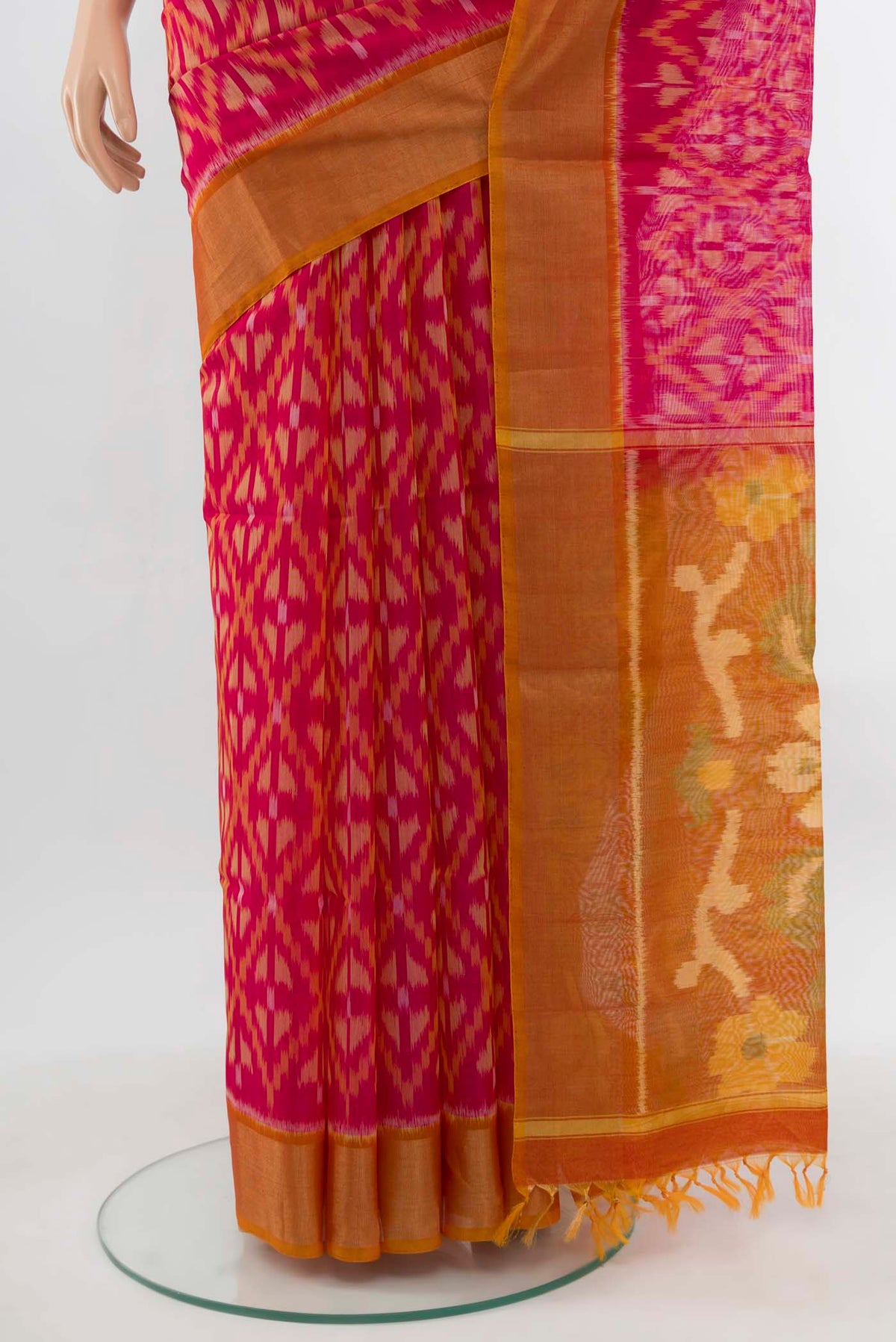 Pleats and pallu of Magenta Maheshwari Silk Cotton Saree with Ikat Print on the body and Silk Border. 