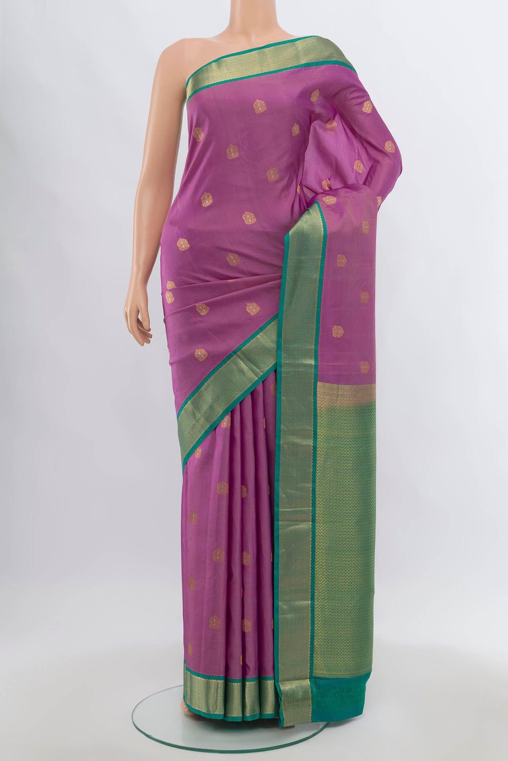 Pure Silk Pure Zari Imperial Pink Kanchipuram Saree with Zari Butta on the body and Silk Border.  displayed on a mannequin