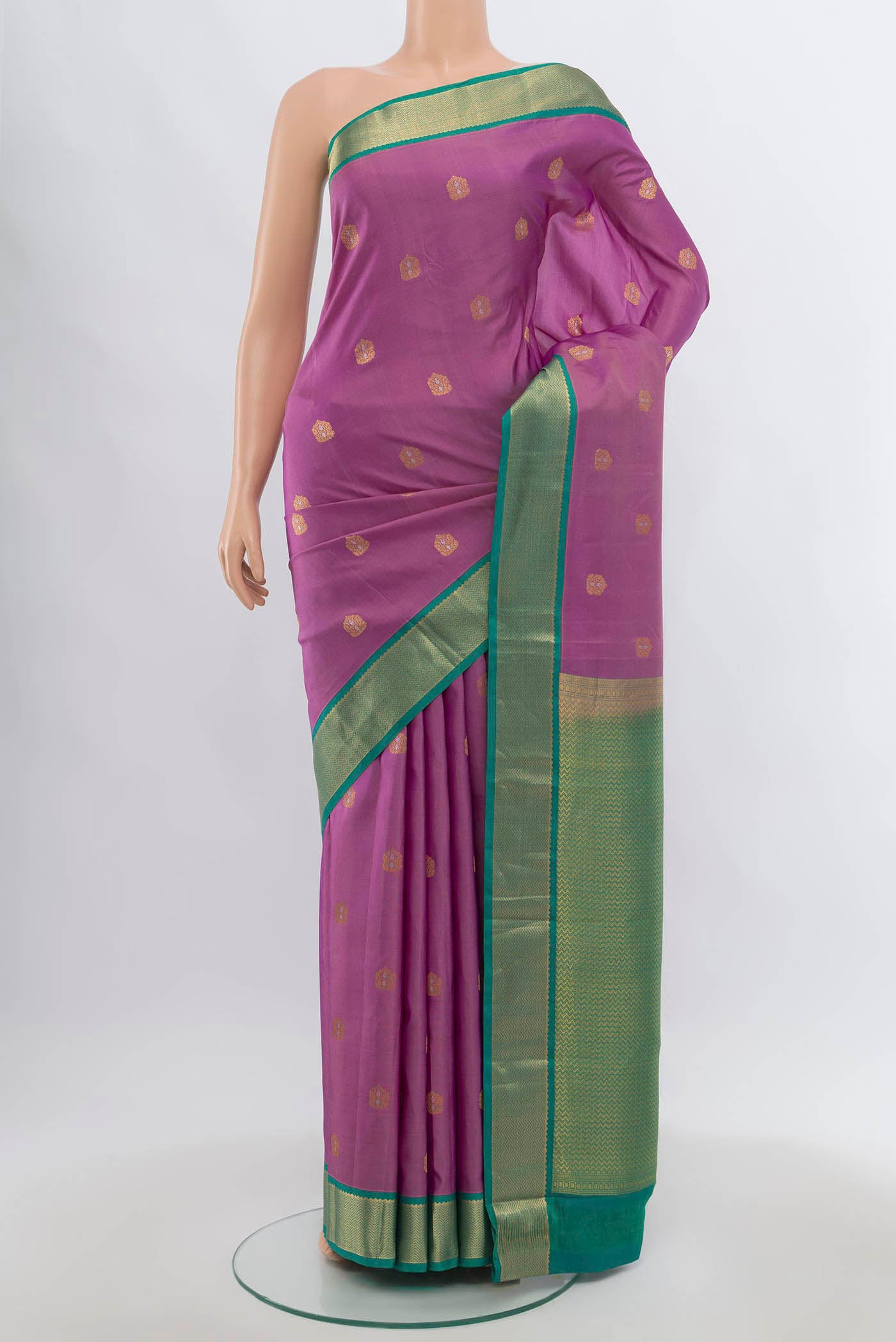 Pure Silk Pure Zari Imperial Pink Kanchipuram Saree with Zari Butta on the body and Silk Border.  displayed on a mannequin