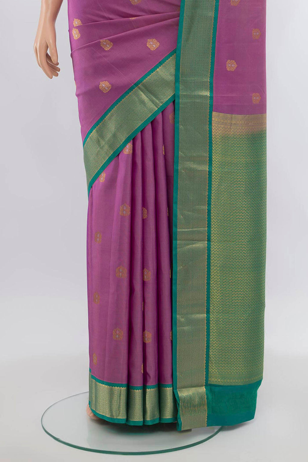 Pleats and pallu of Pure Silk Pure Zari Imperial Pink Kanchipuram Saree with Zari Butta on the body and Silk Border. 