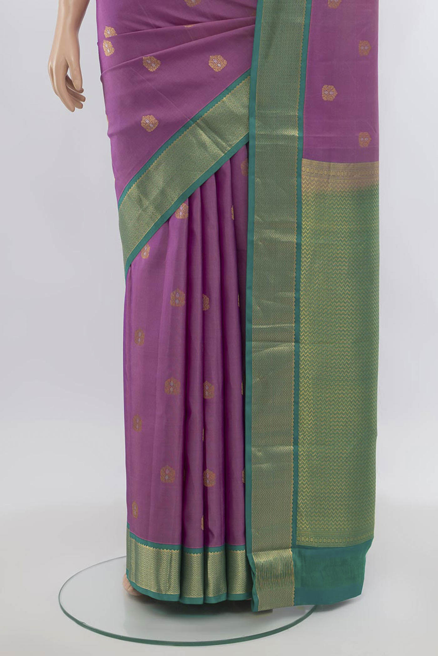 Pleats and pallu of Pure Silk Pure Zari Imperial Pink Kanchipuram Saree with Zari Butta on the body and Silk Border. 