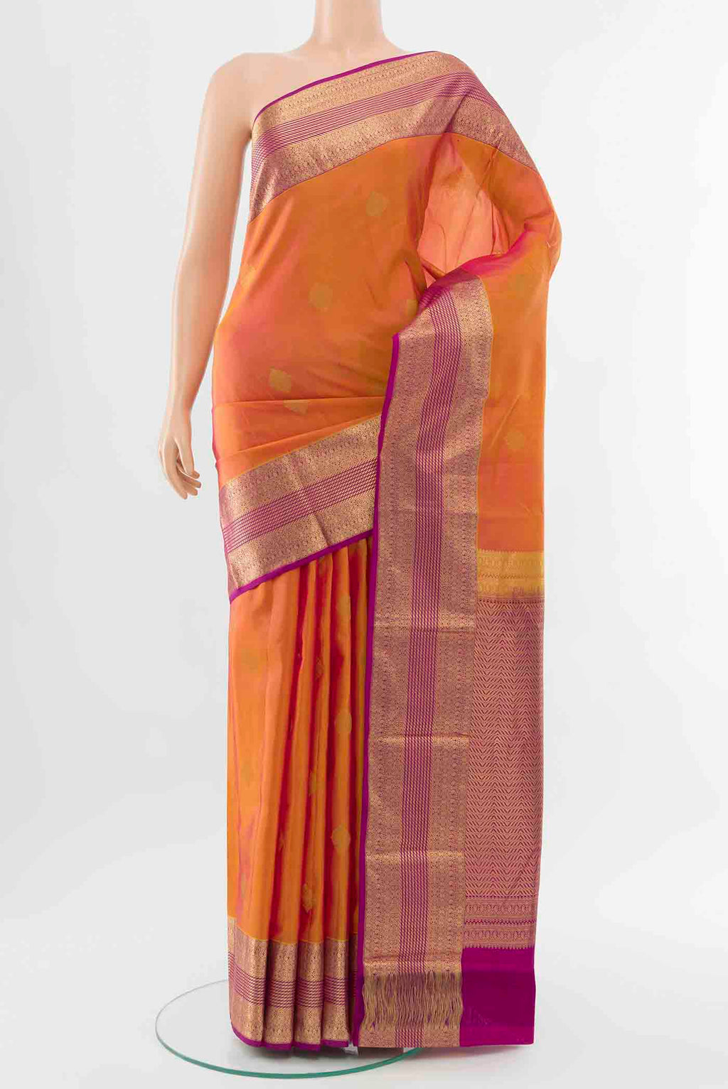 Yellow with Pink Color Kanchipuram Silk Saree with Zari Butta on the body and Zari Border displayed on a mannequin