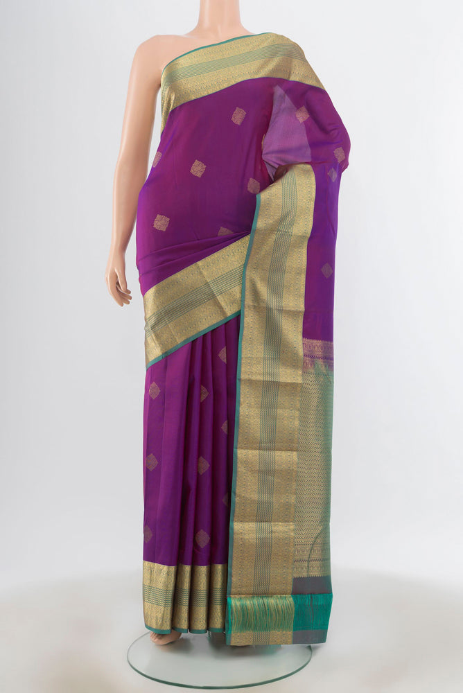 Purple Kanchipuram Silk Saree with Zari Butta on the body and Silk Border.  displayed on a mannequin