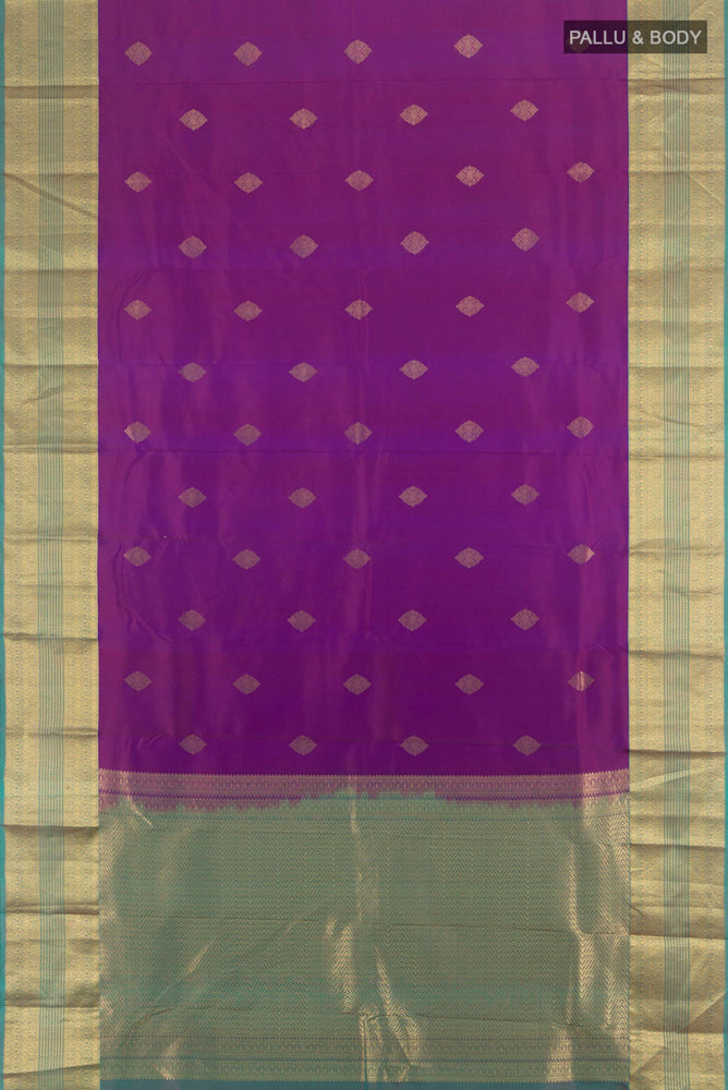Flat view of Purple Kanchipuram Silk Saree with Zari Butta on the body and Silk Border. 
