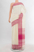 Cream Tussar Silk Saree with Plain Body and Plain Border.  displayed on a mannequin
