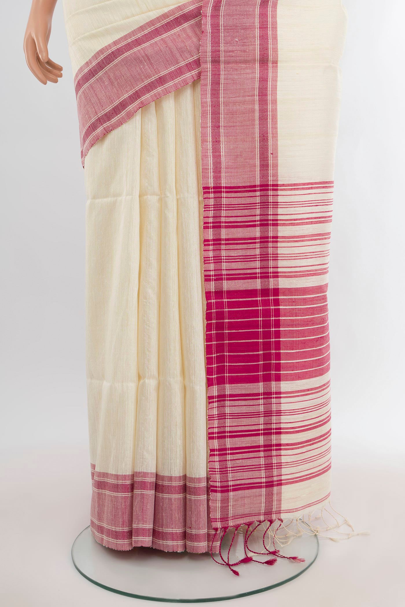 Pleats and pallu of Cream Tussar Silk Saree with Plain Body and Plain Border. 