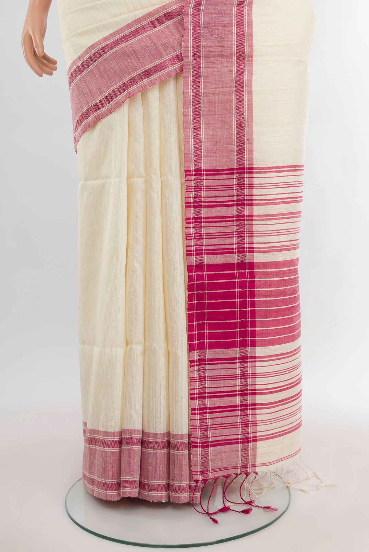 Pleats and pallu of Cream Tussar Silk Saree with Plain Body and Plain Border. 