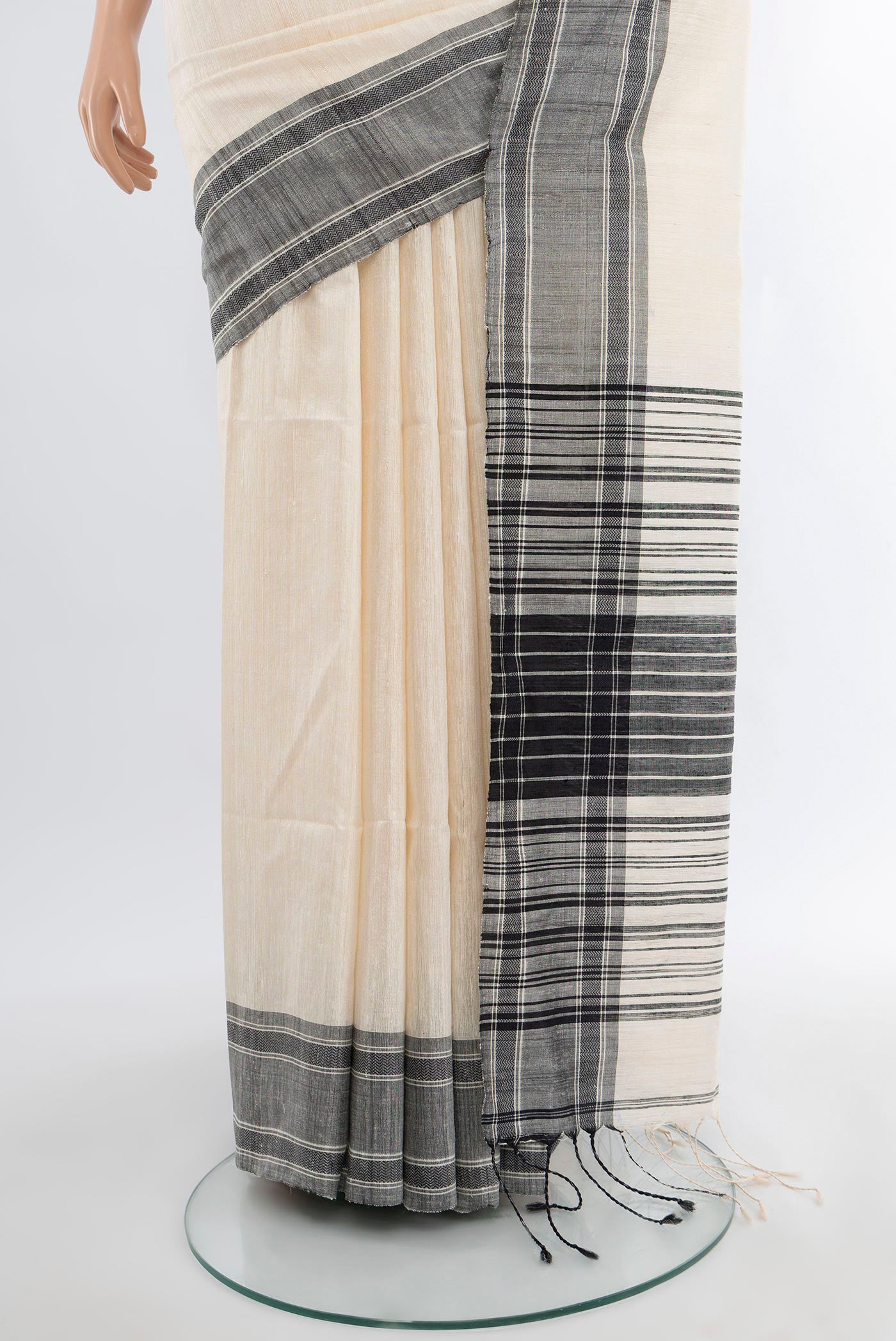 Pleats and pallu of Off White Tussar Silk Saree with Plain Body and Plain Border. 