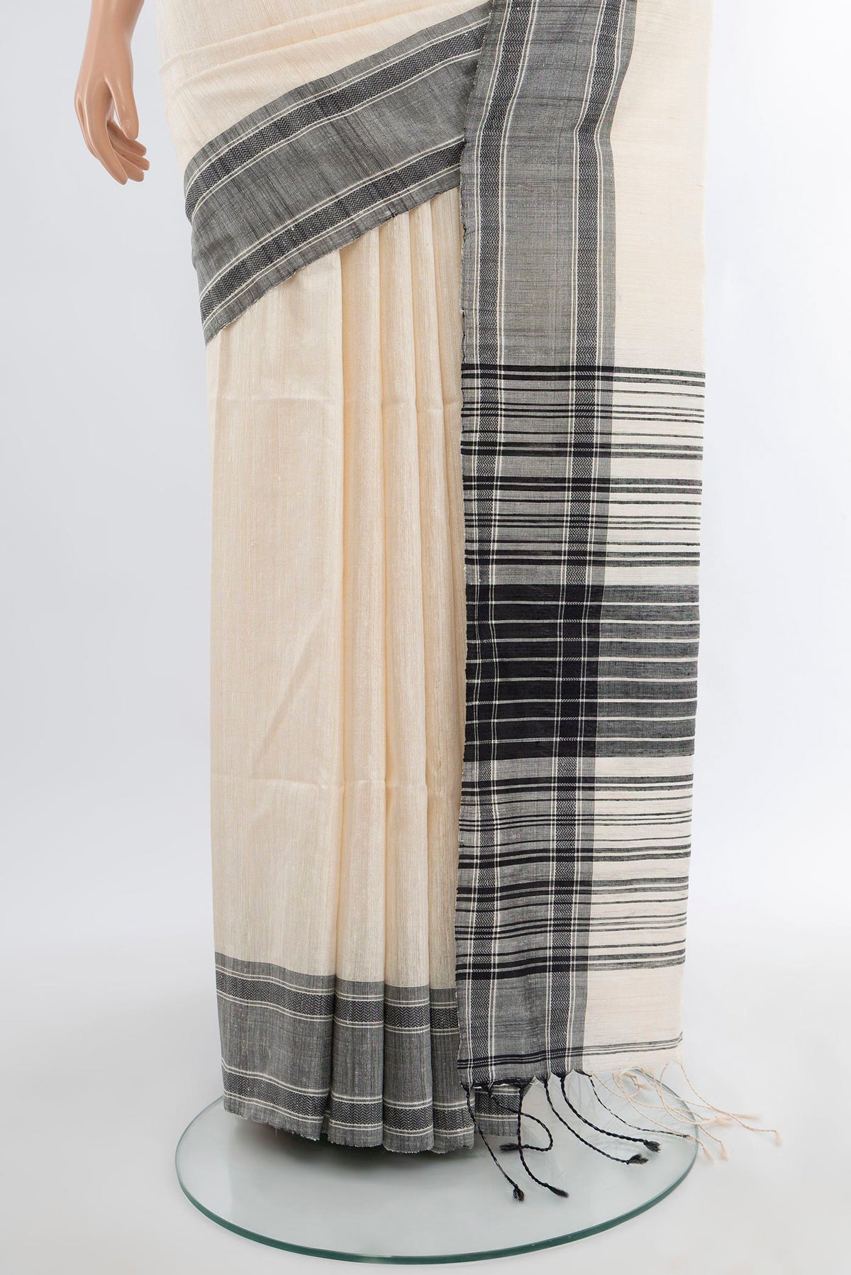 Pleats and pallu of Off White Tussar Silk Saree with Plain Body and Plain Border. 