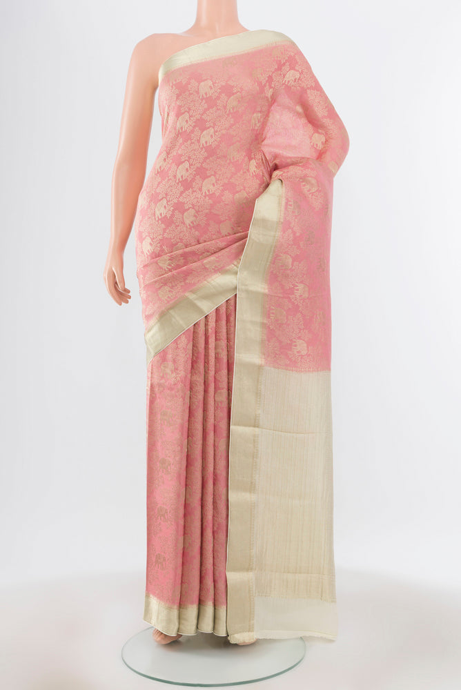Pure Silk Pure Zari Bronze Georgette Saree with Zari Butta on the body and Silk Border.  displayed on a mannequin
