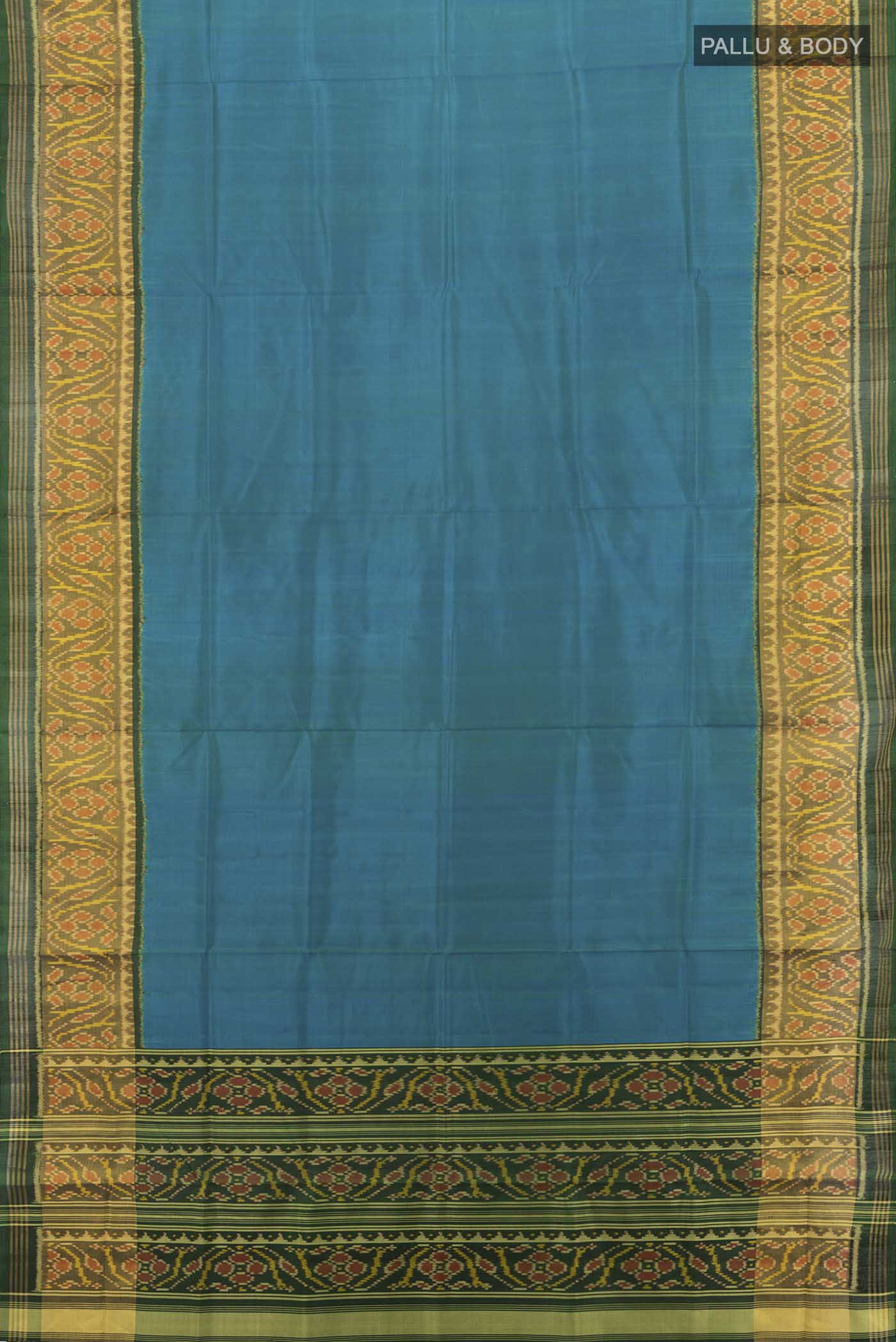 Flat view of Bottle Green Rajkot Patola Silk Saree with Zari Butta on the body and Silk Border. 