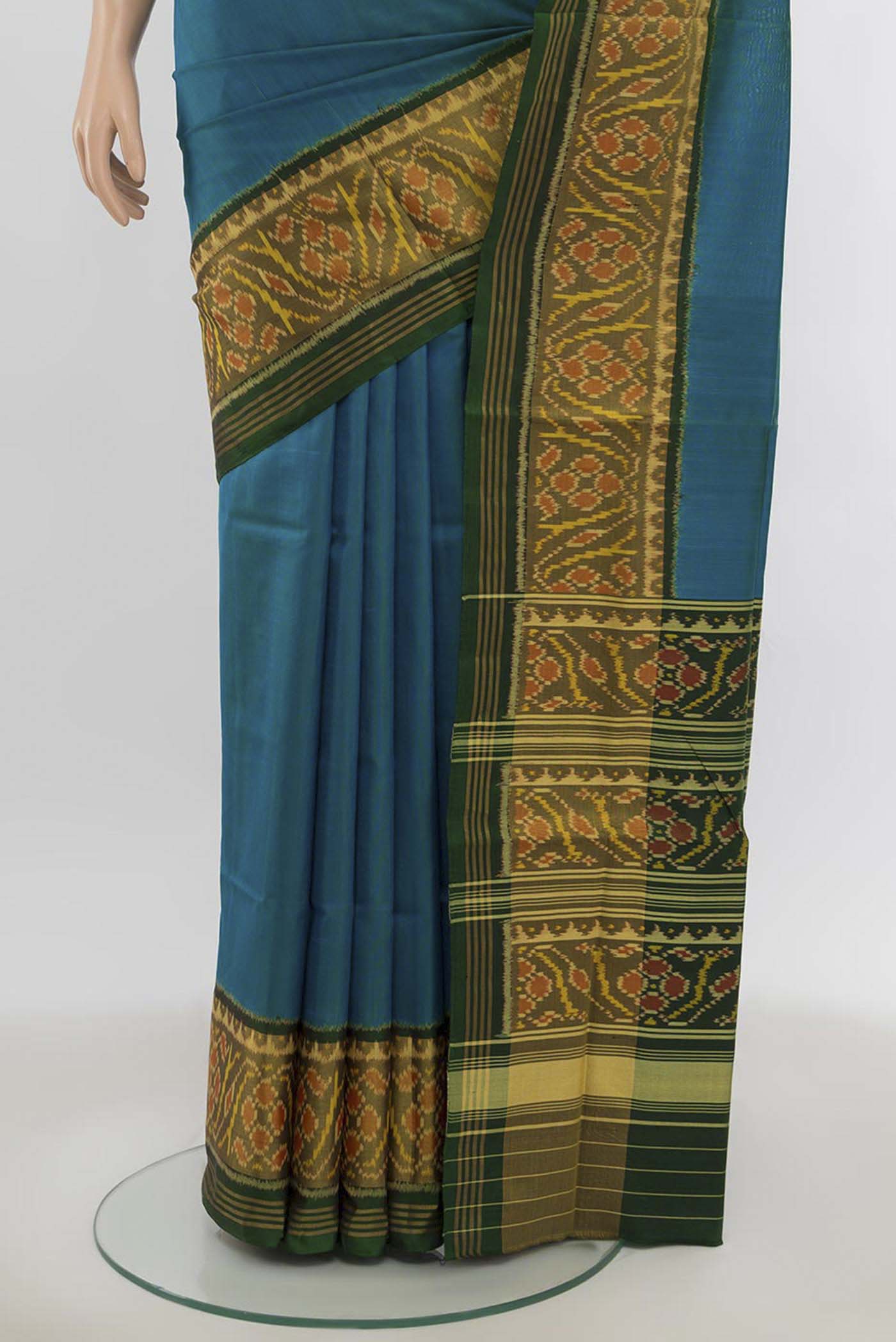 Pleats and pallu of Bottle Green Rajkot Patola Silk Saree with Zari Butta on the body and Silk Border. 