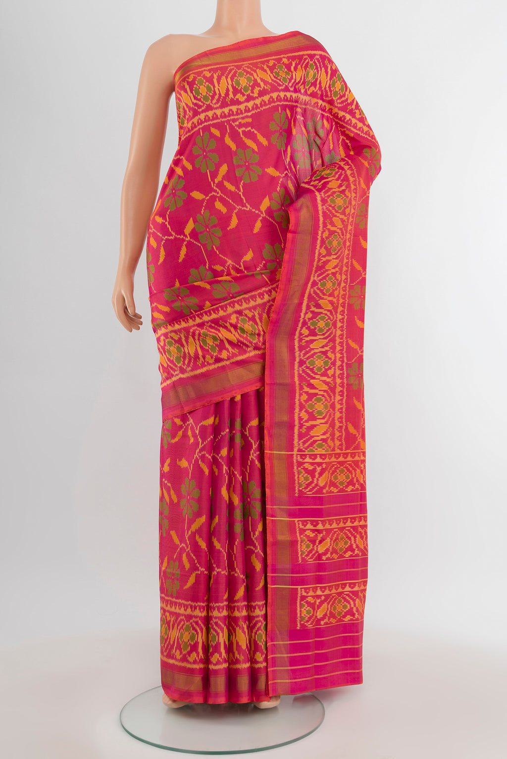 Pure Silk Pure Zari Multi Color Rajkot Patola Saree with Ikat Print on the body and Silk Border.  displayed on a mannequin