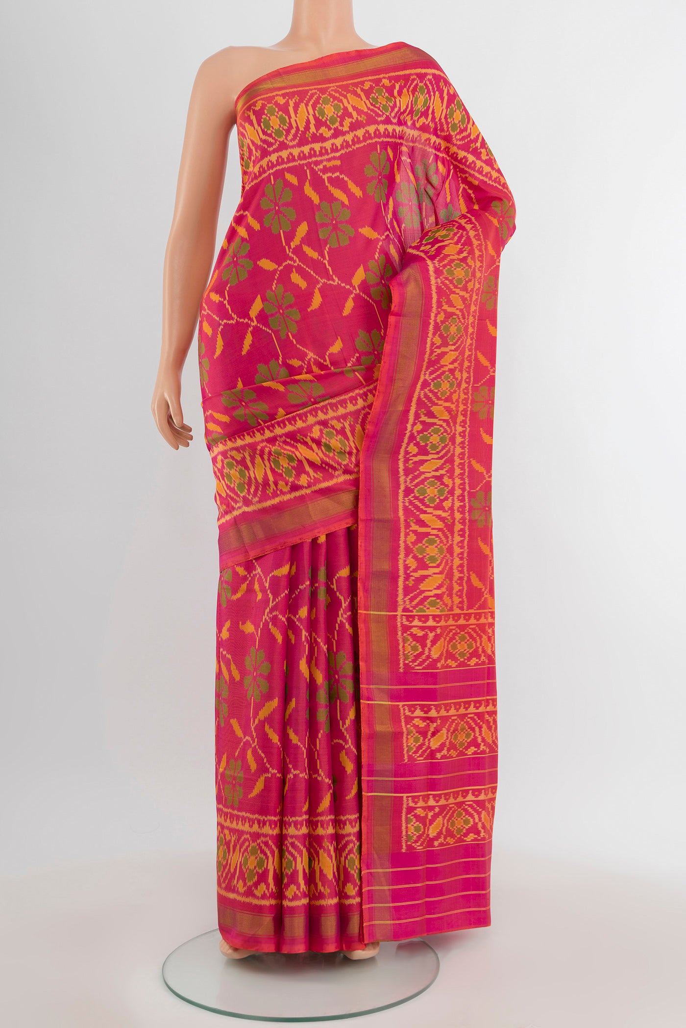Pure Silk Pure Zari Multi Color Rajkot Patola Saree with Ikat Print on the body and Silk Border.  displayed on a mannequin