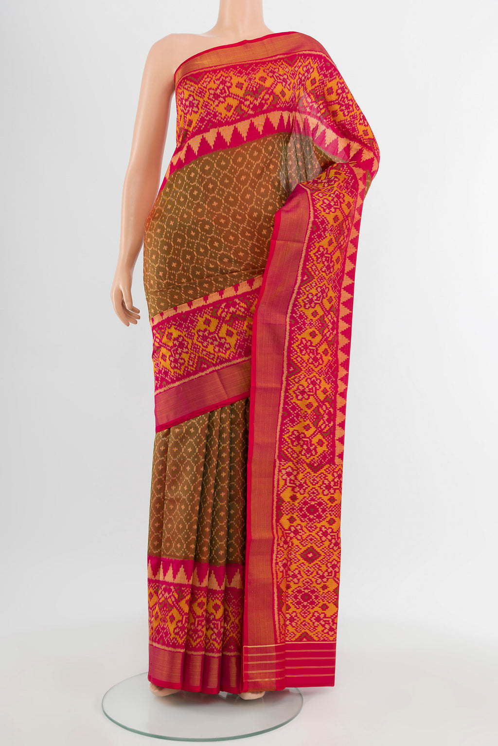 Pure Silk Pure Zari Multi Color Rajkot Patola Saree with Ikat Print on the body and Silk Border.  displayed on a mannequin