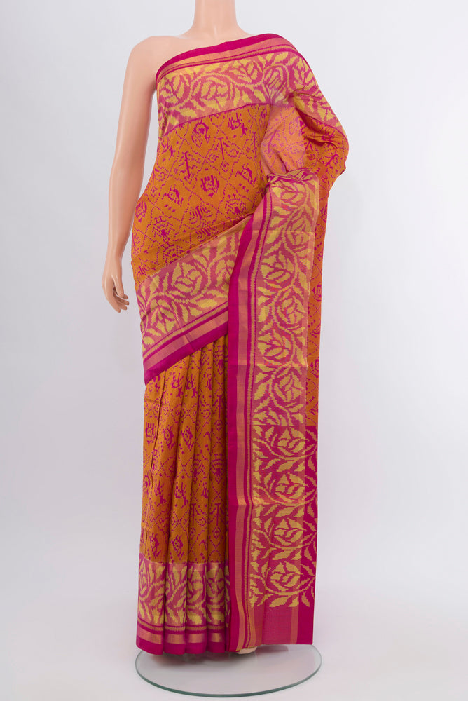 Magenta Rajkot Patola Silk Saree with Zari Butta on the body and Silk Border.  displayed on a mannequin