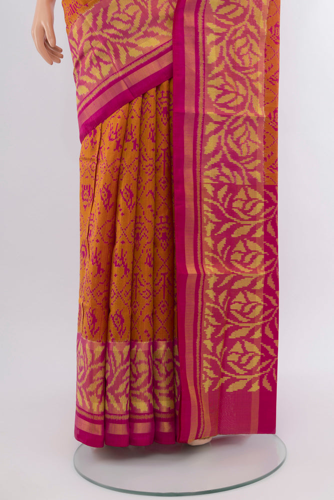 Pleats and pallu of Magenta Rajkot Patola Silk Saree with Zari Butta on the body and Silk Border. 
