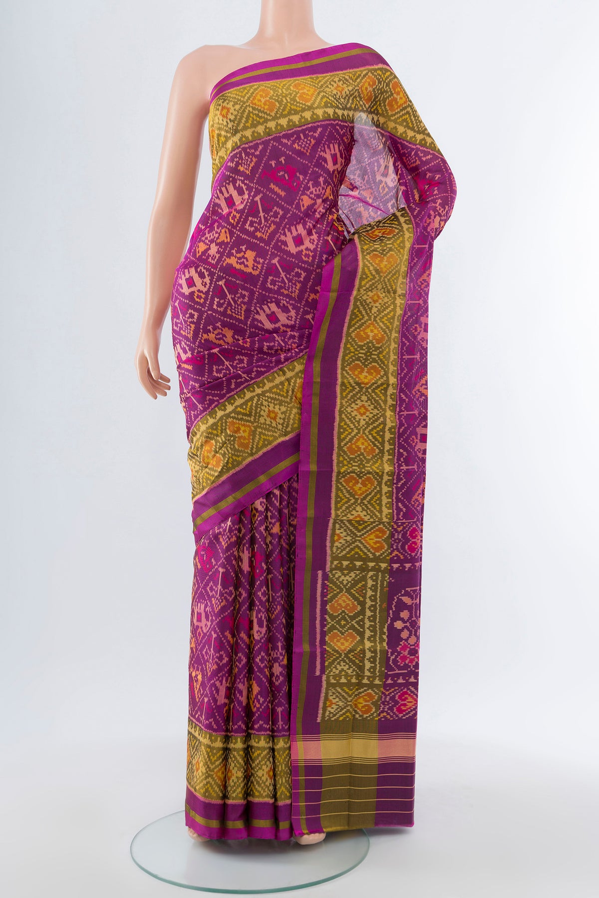 Multi Color Rajkot Patola Silk Saree with Ikat Print on the body and Silk Border.  displayed on a mannequin