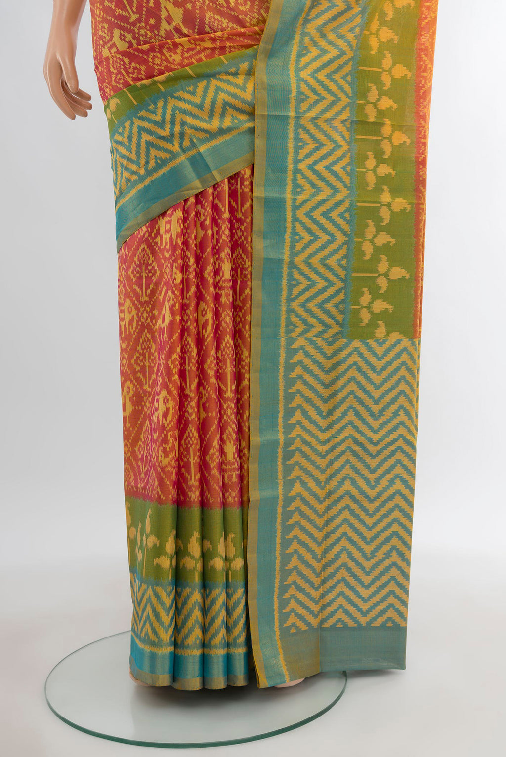 Pleats and pallu of Orange Rajkot Patola Silk Saree with Pure Ikat on the body and Ikat Border. 