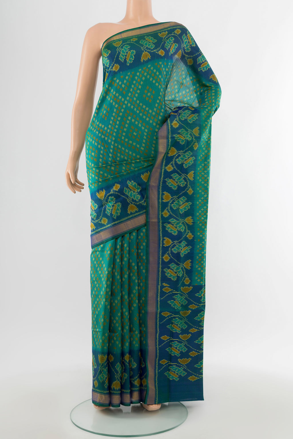 Multi Color Rajkot Patola Silk Saree with Ikat Print on the body and Silk Border.  displayed on a mannequin
