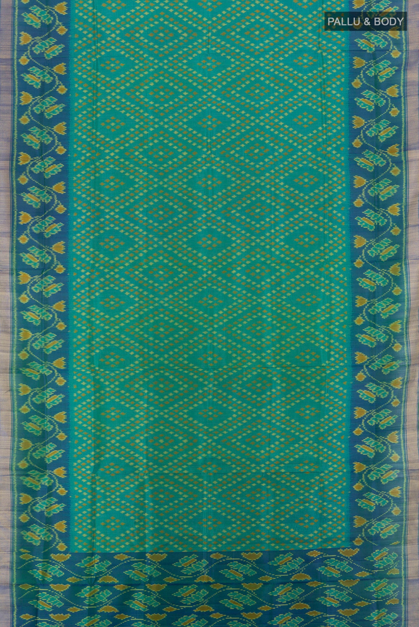 Flat view of Multi Color Rajkot Patola Silk Saree with Ikat Print on the body and Silk Border. 