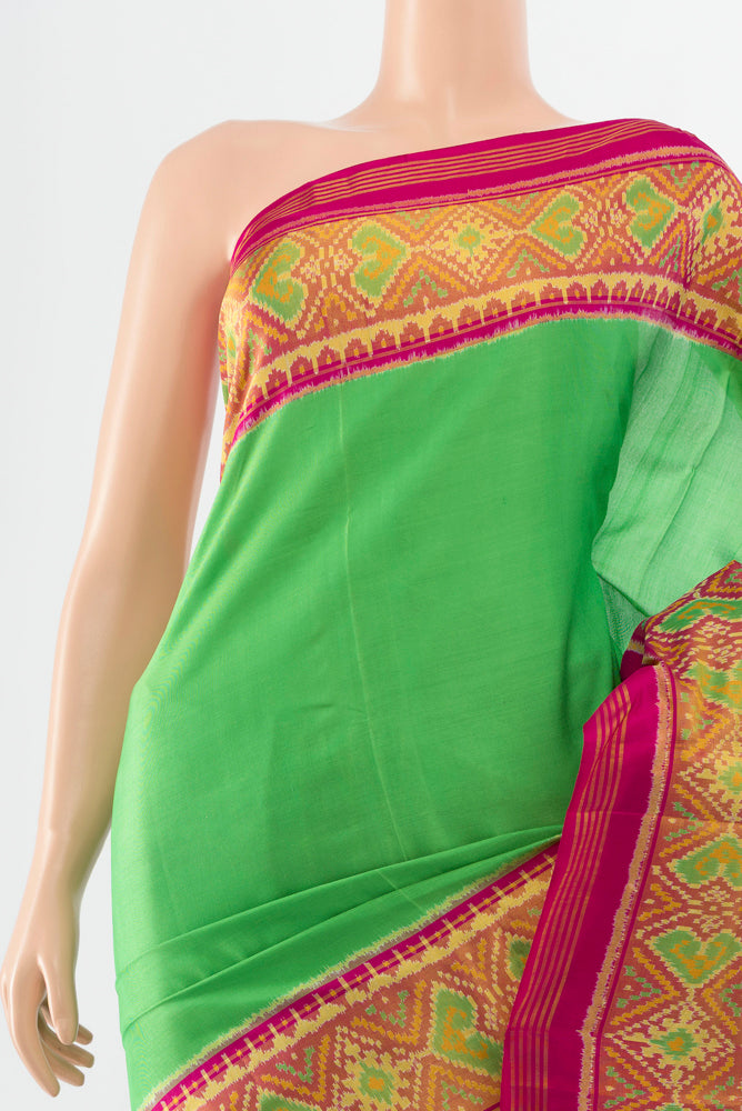 Border image of Parrot Green Rajkot Patola Silk Saree with Batik Print on the body and Silk Border. 