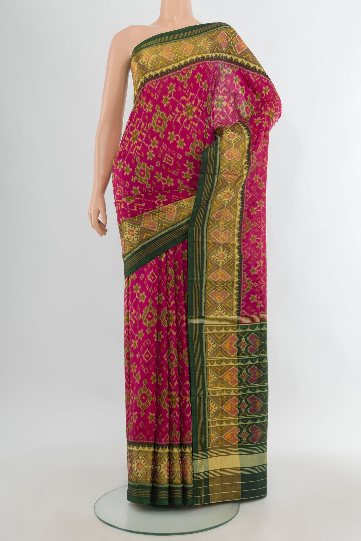 Pure Silk Pink Rajkot Patola Saree with Pure Ikat on the body and Ikat Border.  displayed on a mannequin