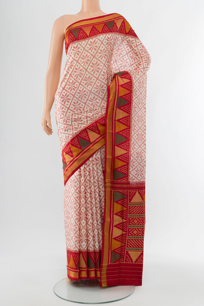 Off White Rajkot Patola Silk Saree with Batik Print on the body and Silk Border.  displayed on a mannequin