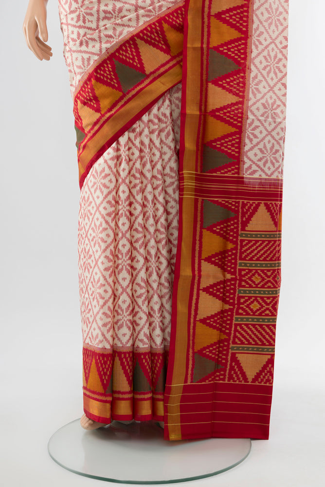 Pleats and pallu of Off White Rajkot Patola Silk Saree with Batik Print on the body and Silk Border. 