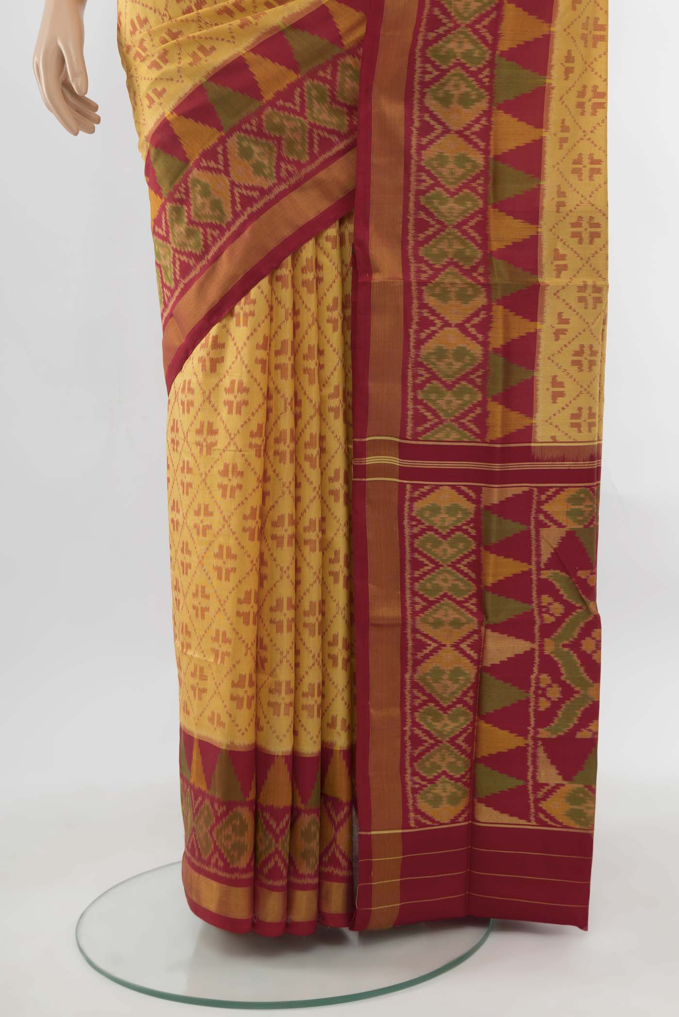 Pleats and pallu of Beige Rajkot Patola Silk Saree with Ikat Print on the body and Silk Border. 