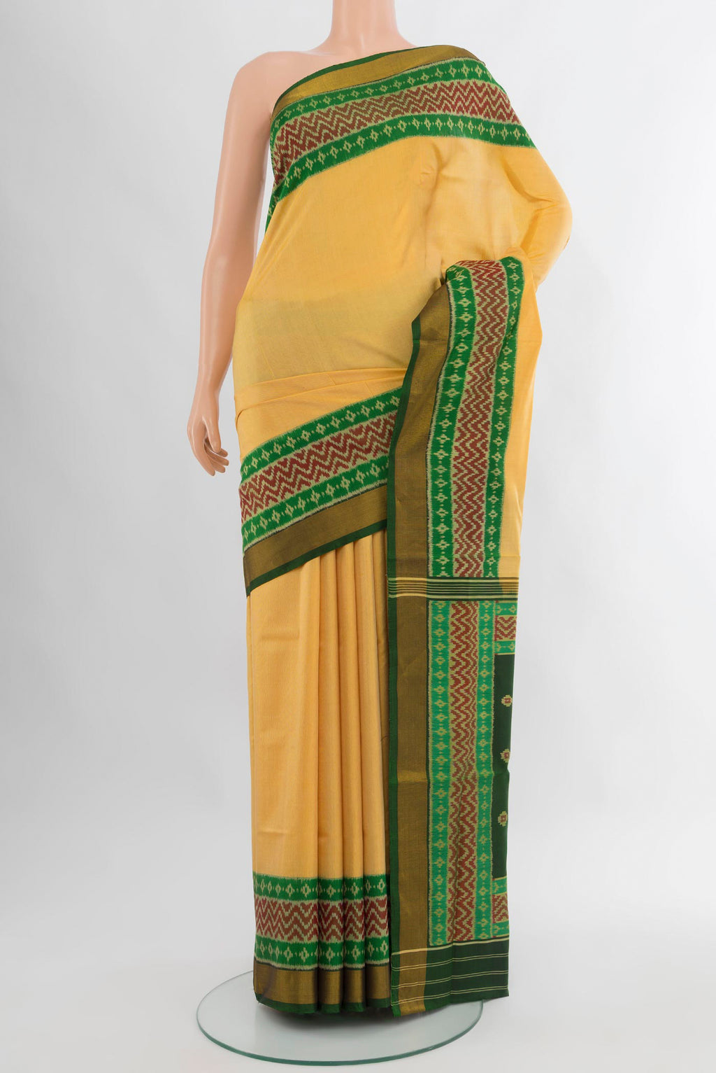 Yellow Rajkot Patola Silk Saree with Plain Body and Ikat Border.  displayed on a mannequin