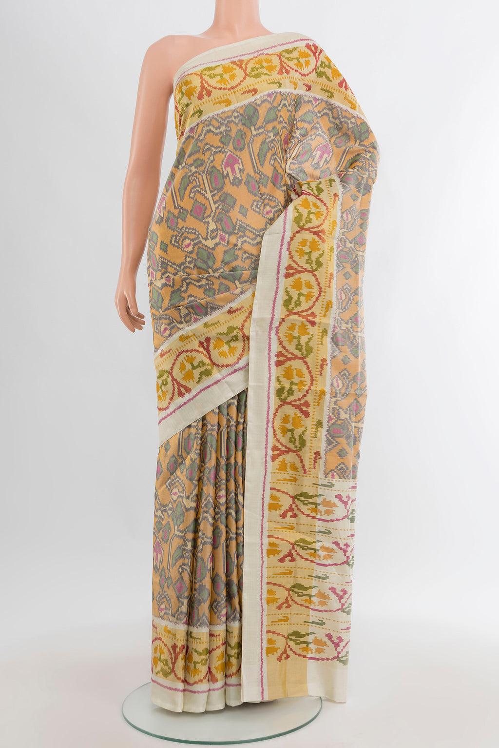 Multi Color Rajkot Patola Silk Saree with Pure Ikat on the body and Ikat Border.  displayed on a mannequin