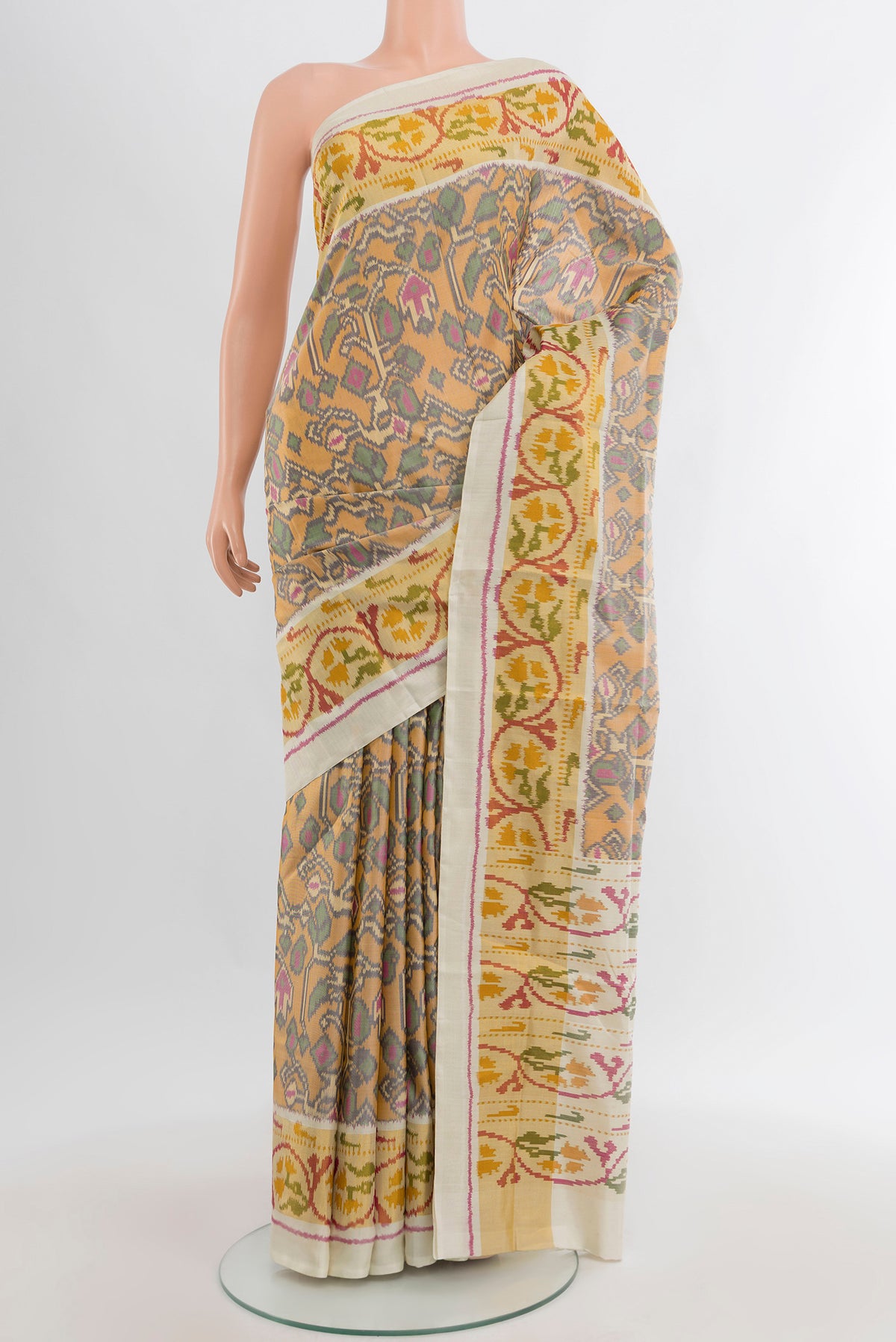 Multi Color Rajkot Patola Silk Saree with Pure Ikat on the body and Ikat Border.  displayed on a mannequin