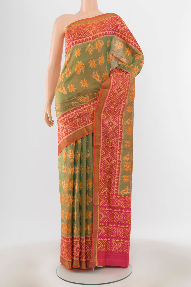 Peach Rajkot Patola Silk Saree with Ikat Print on the body and Silk Border.  displayed on a mannequin