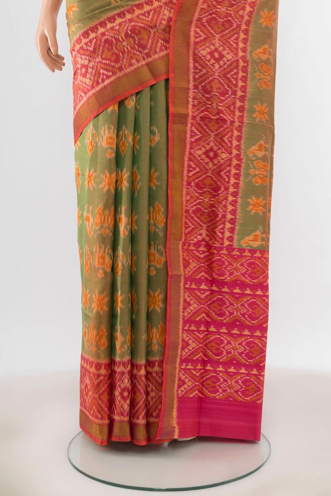 Pleats and pallu of Peach Rajkot Patola Silk Saree with Ikat Print on the body and Silk Border. 